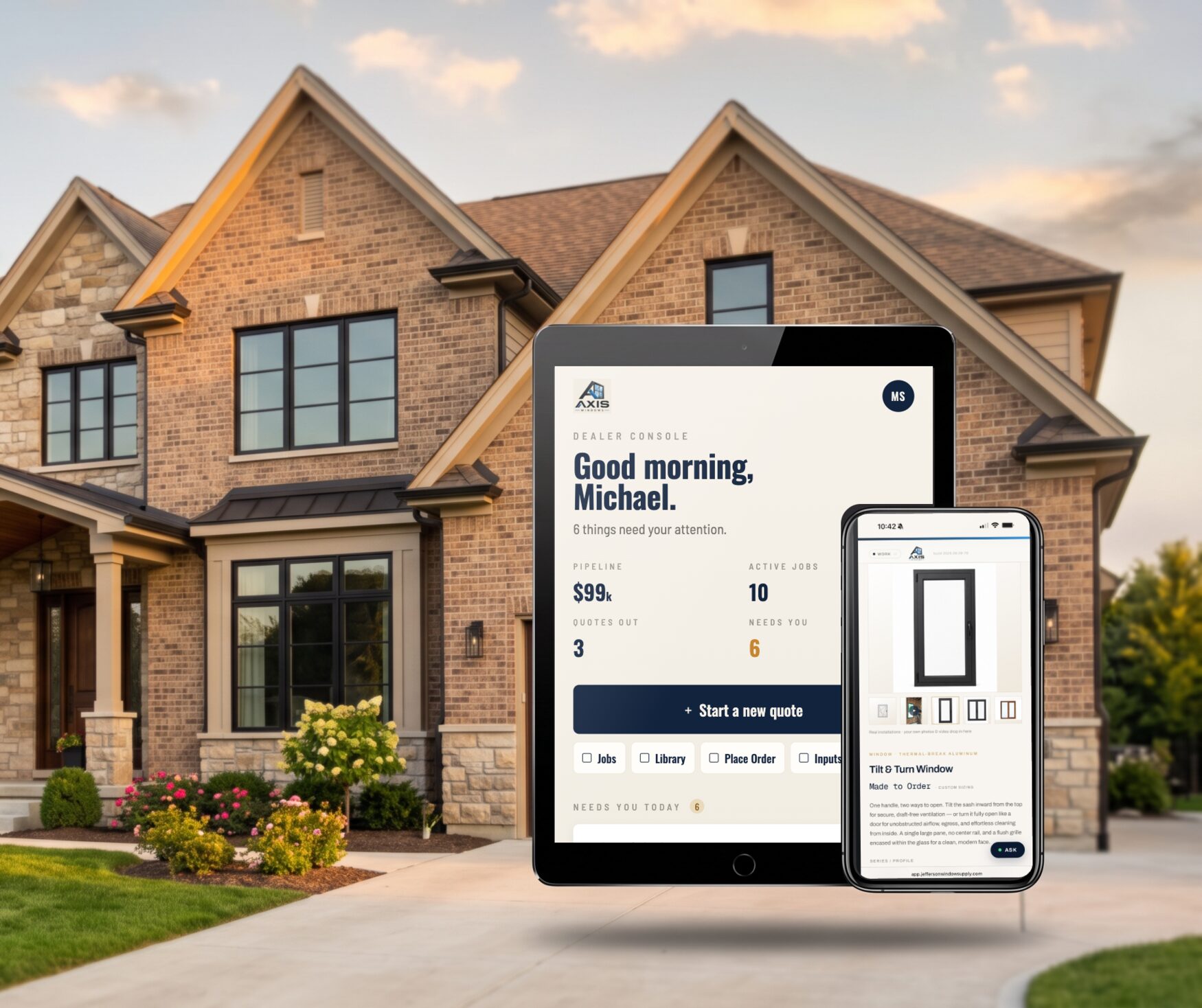 Brick home with black aluminum windows, with the dealer app open on a tablet and a phone