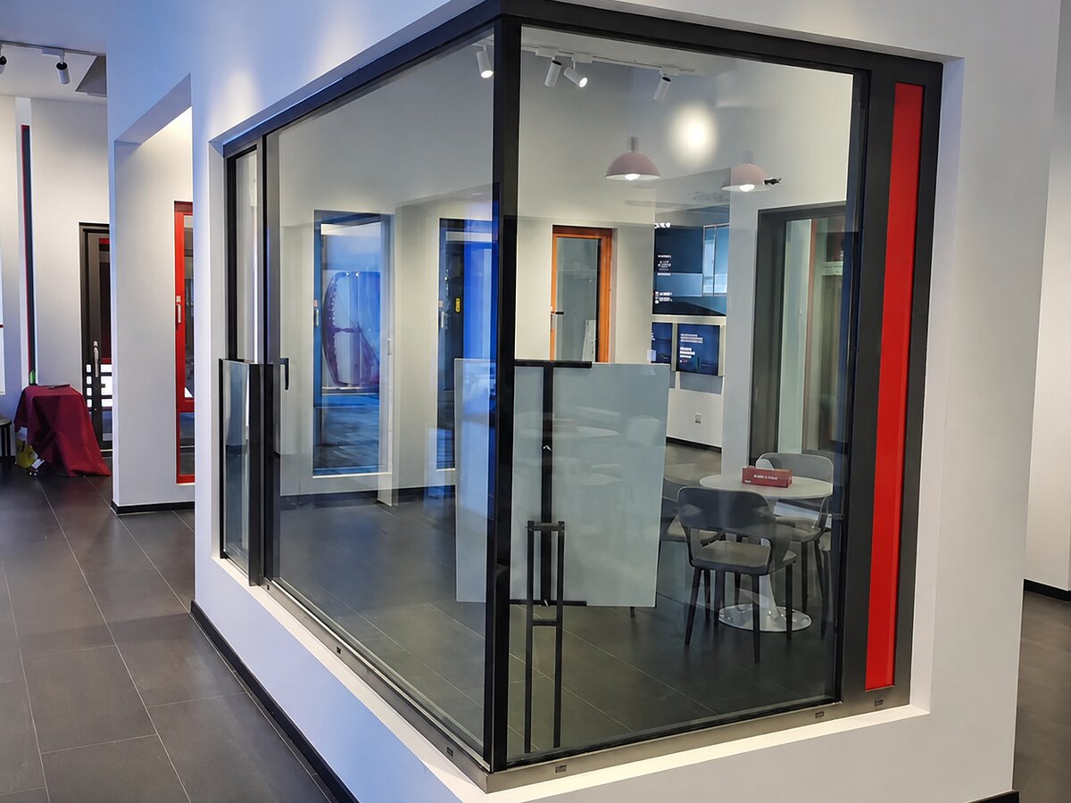 Corner glazing with slim black frames in a showroom